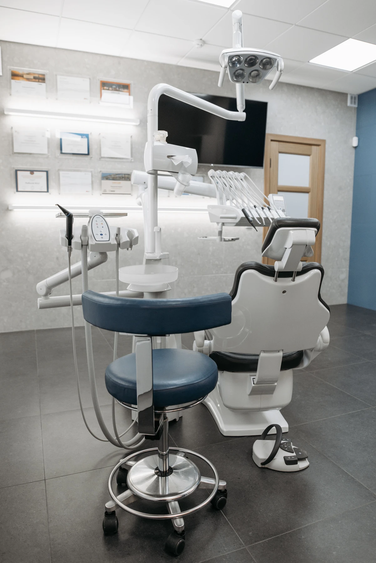 Bright dental office with a treatment chair and modern equipment.